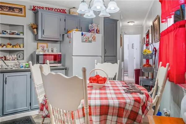 a bedroom with a bed couch and a window