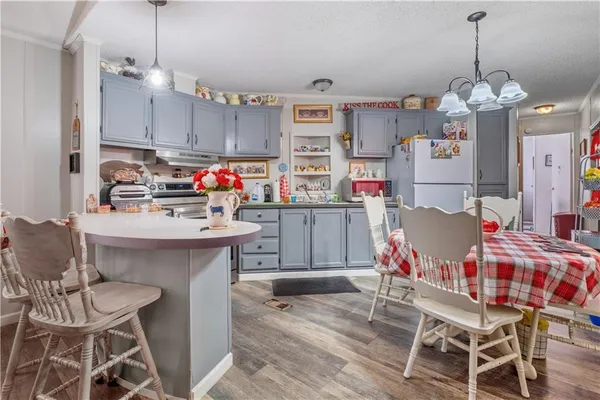 a bedroom with a bed couch and dresser