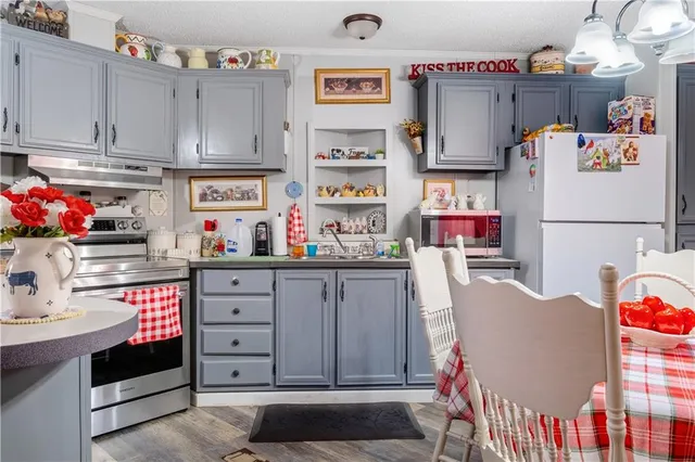 a bathroom with a sink toilet and mirror