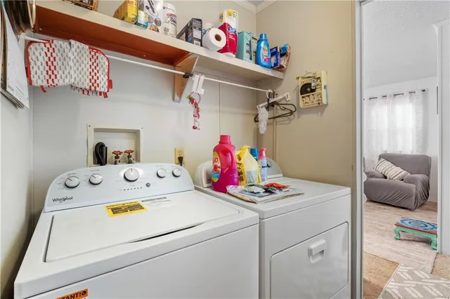 a bathroom with a toilet and shower curtain