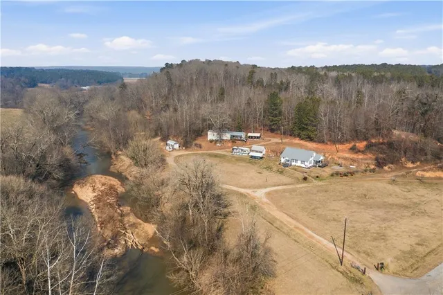 a view of a swimming pool with a table and chairs