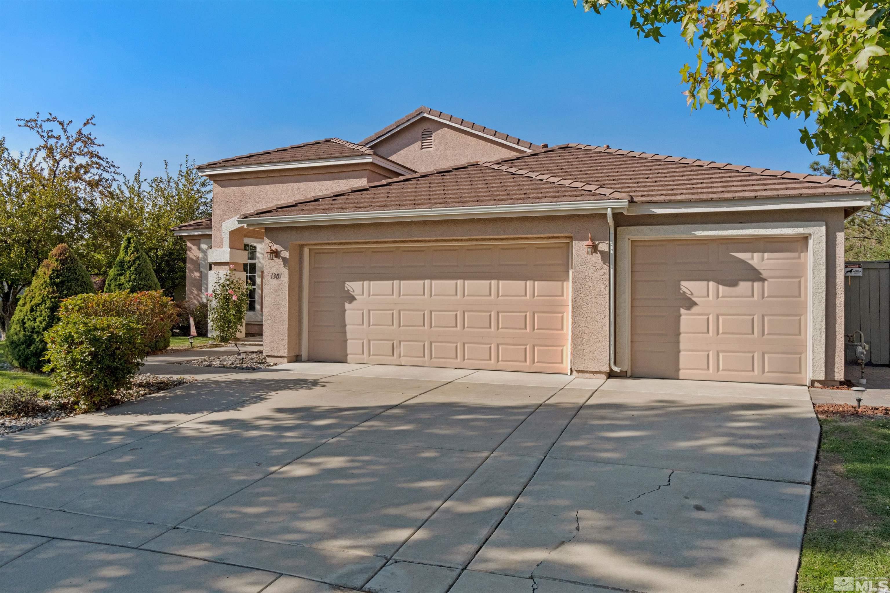 1301 Cranwood Court Reno, NV 89521 - Photo 34 of 34 a front view of a house with a garage