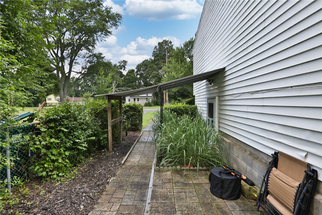 1359 Lehigh Station Road Henrietta, NY 14467 - Photo 28 of 32 Awning covers lower level apartment entrance