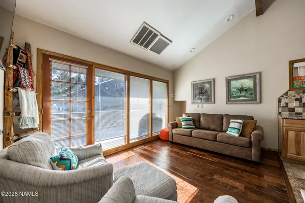 a living room with furniture and a large window