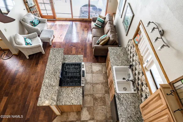 a reading room with furniture and a rug