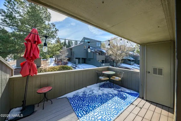 a view of balcony with wooden floor