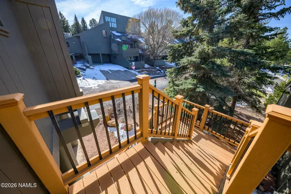 a view of an entryway with wooden floor