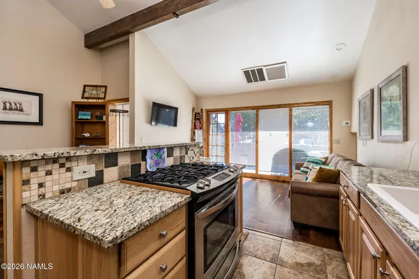 a kitchen with a stove and a sink