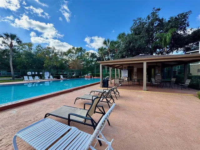 a view of a patio with swimming pool