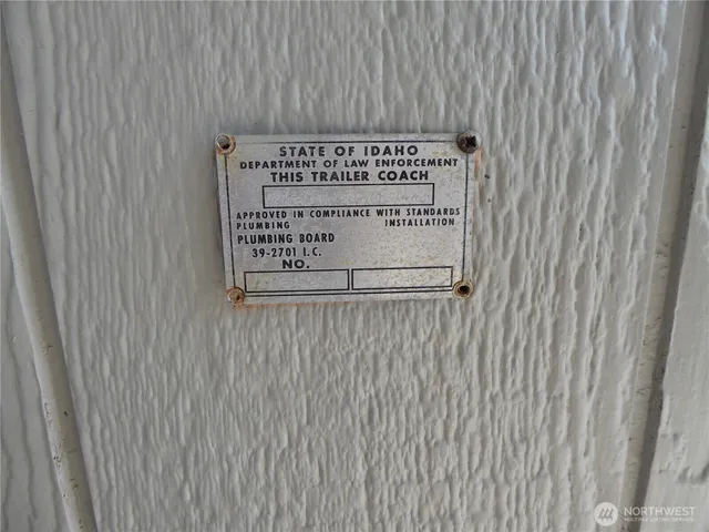 a sign on a wooden wall