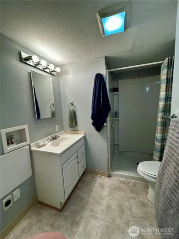 a view of bathroom with a sink and mirror