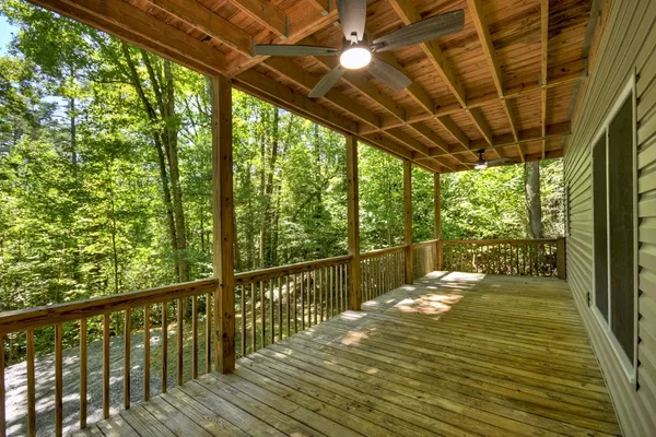 a view of a balcony with wooden floor