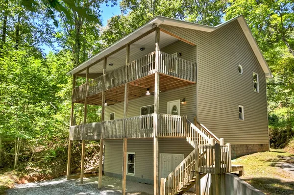 a front view of a house with parking area