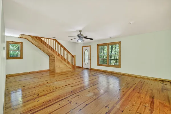 a view of an entryway with wooden floor