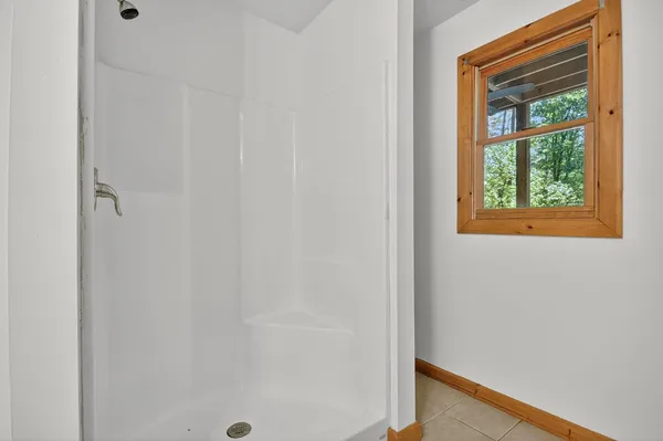 a small space with a window and a bathroom