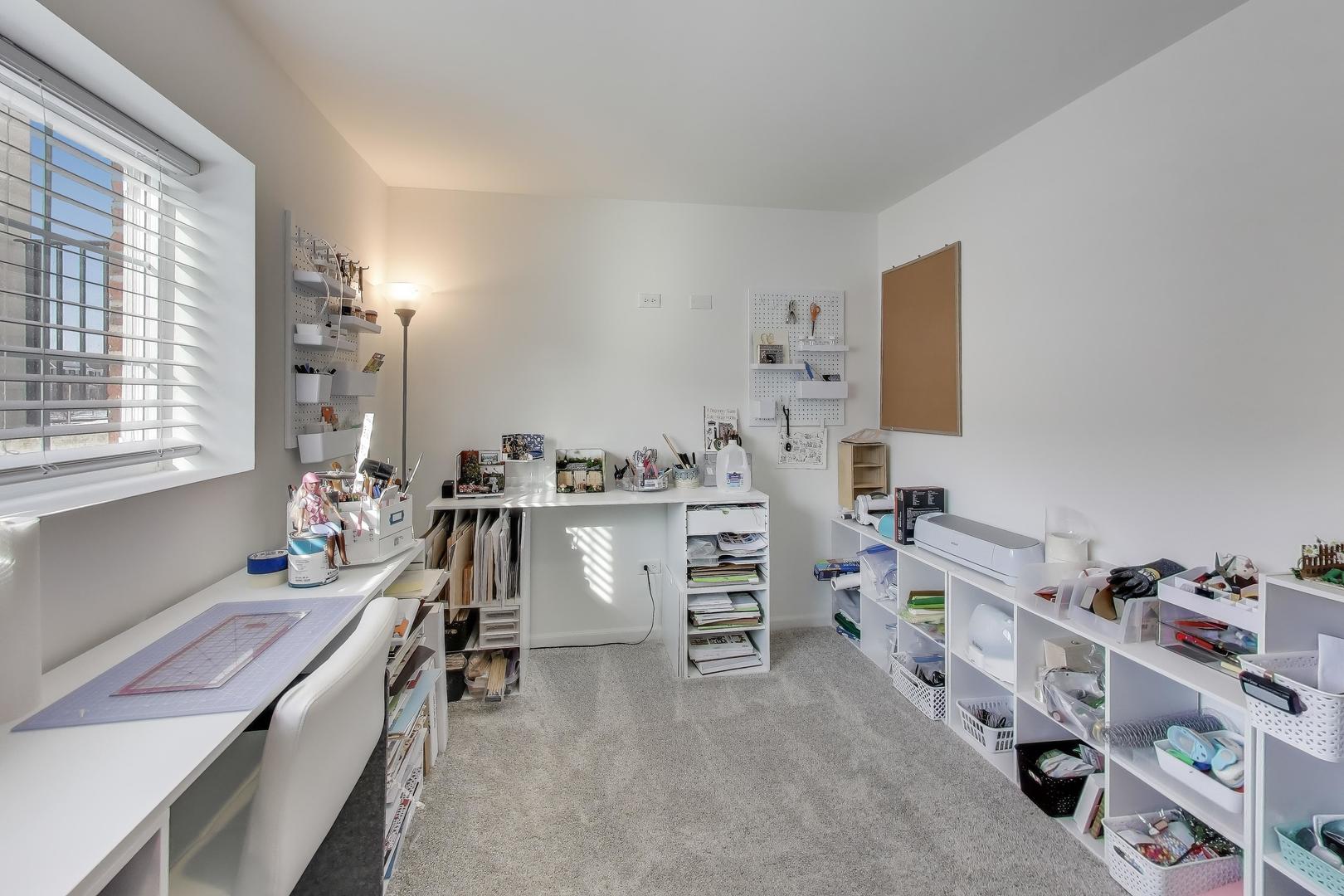 709 Neubauer Circle Lindenhurst, IL 60046 - Photo 21 of 25 a room with a desk and workspace