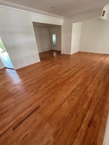 a living room with furniture a rug and a window