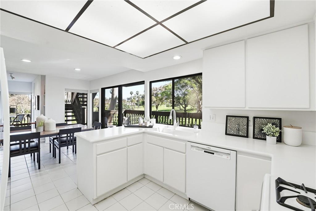 10 Lago Norte Irvine, CA 92612 - Photo 11 of 29 a kitchen with a sink and cabinets