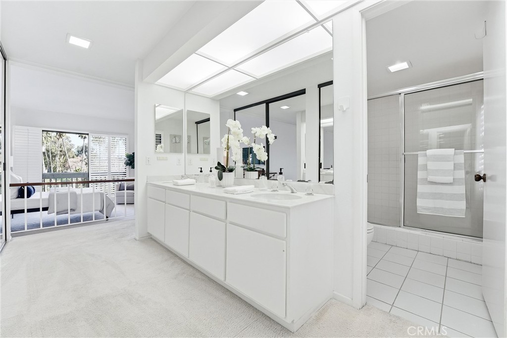 10 Lago Norte Irvine, CA 92612 - Photo 13 of 29 a bathroom with a double vanity sink mirror and shower