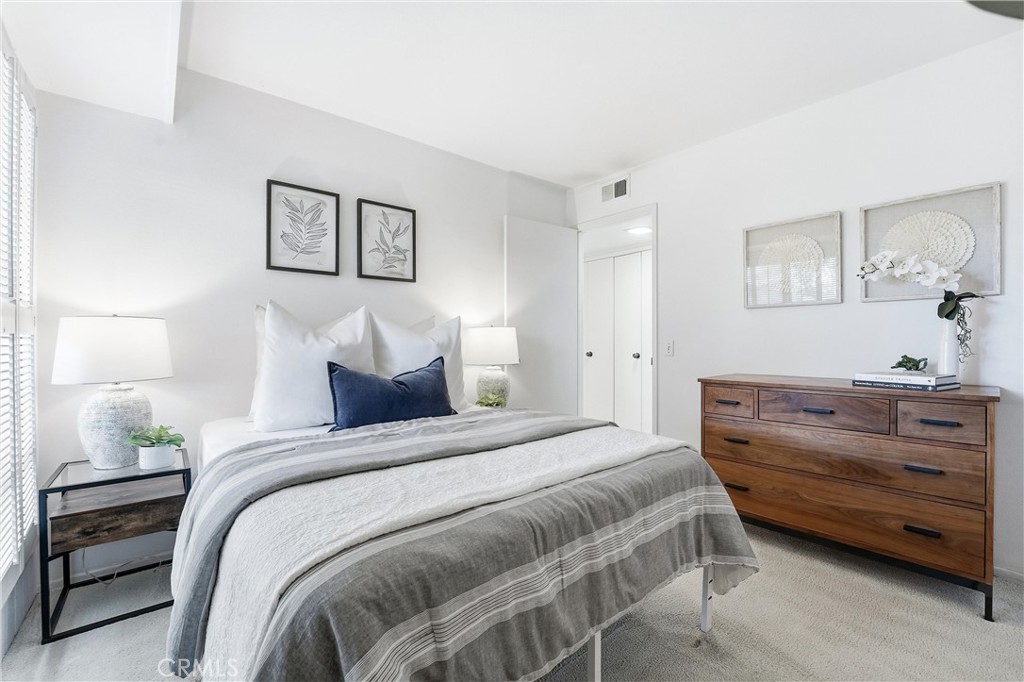 10 Lago Norte Irvine, CA 92612 - Photo 15 of 29 a bedroom with a bed and a night stand