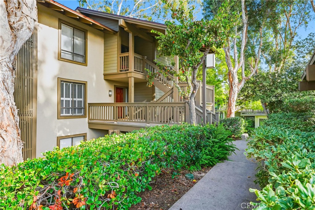 10 Lago Norte Irvine, CA 92612 - Photo 28 of 29 a view of a house with a small yard plants and large trees