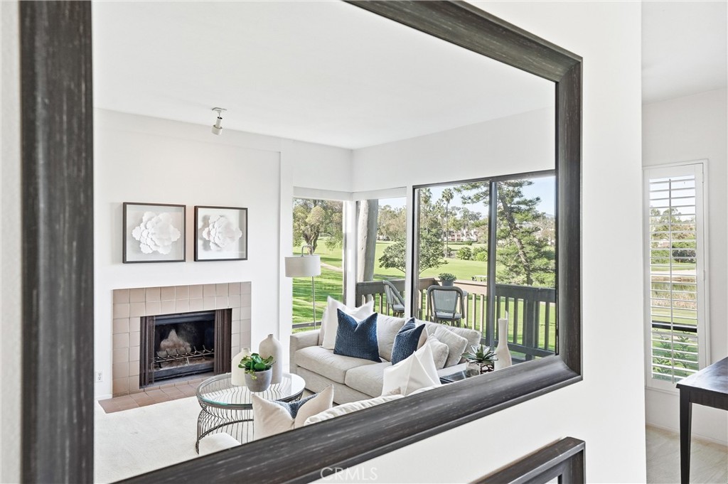 10 Lago Norte Irvine, CA 92612 - Photo 3 of 29 a living room with furniture and a fireplace