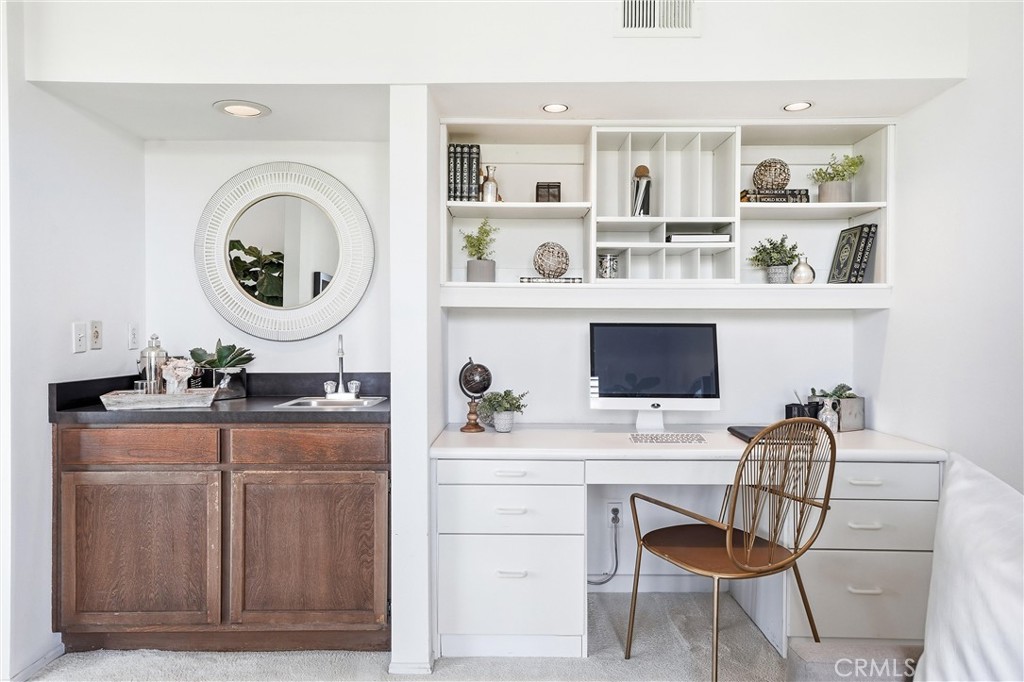 10 Lago Norte Irvine, CA 92612 - Photo 6 of 29 a room with a workspace and a television