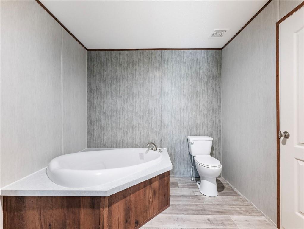 222 Lynn Road Bethlehem, GA 30620 - Photo 18 of 45 a bathroom with a toilet and a sink