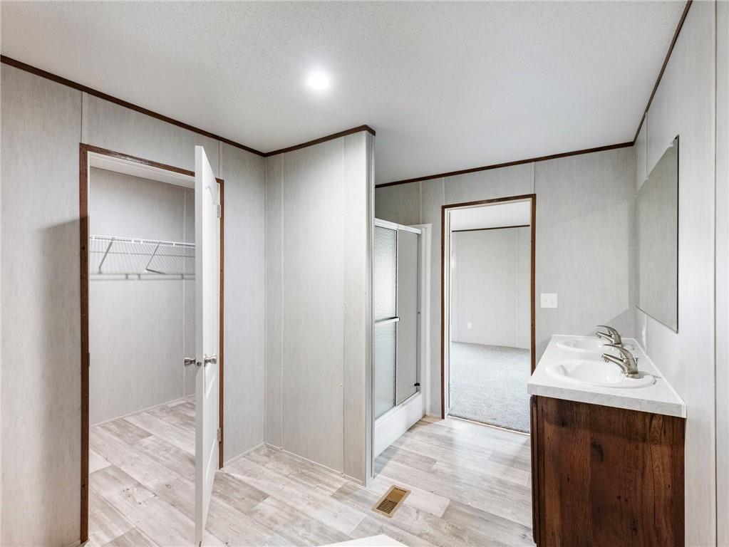 222 Lynn Road Bethlehem, GA 30620 - Photo 19 of 45 a bathroom with a sink and a mirror