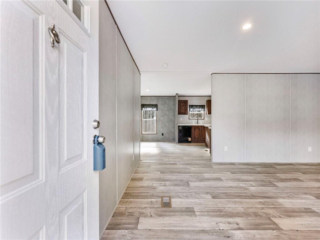 222 Lynn Road Bethlehem, GA 30620 - Photo 2 of 45 a view of a hallway with wooden floor and staircase