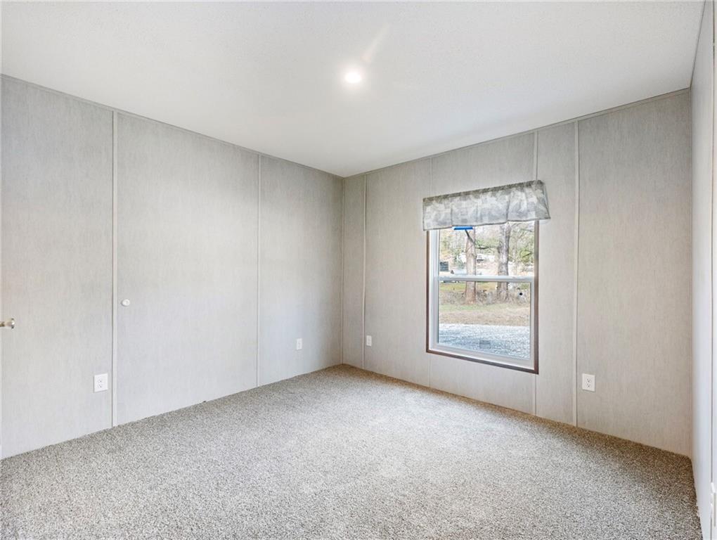 222 Lynn Road Bethlehem, GA 30620 - Photo 22 of 45 an empty room with windows and closet
