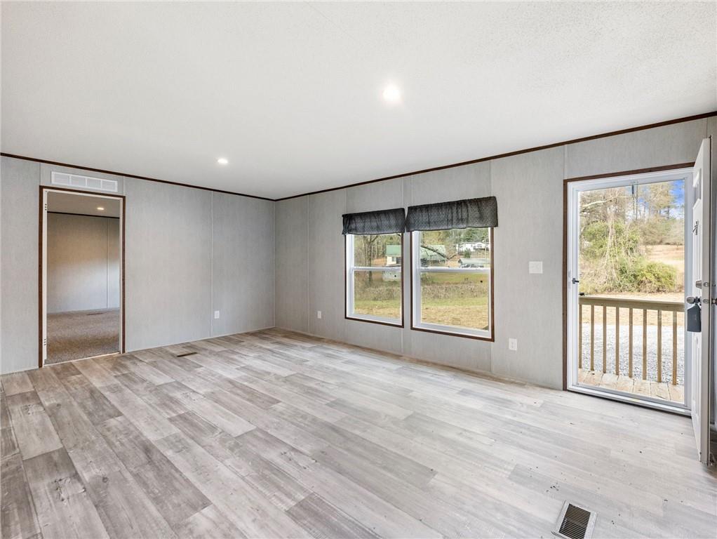 222 Lynn Road Bethlehem, GA 30620 - Photo 3 of 45 a view of an empty room with glass door