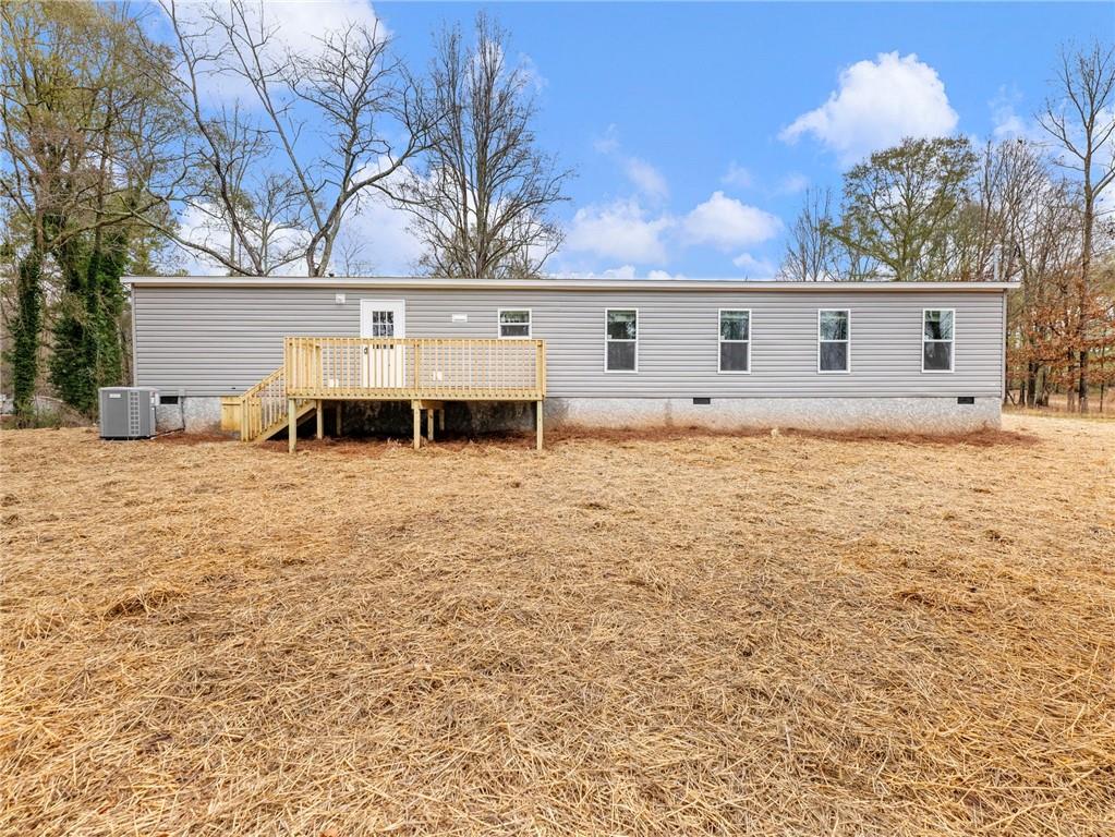 222 Lynn Road Bethlehem, GA 30620 - Photo 34 of 45 a house that has a tree in front of it