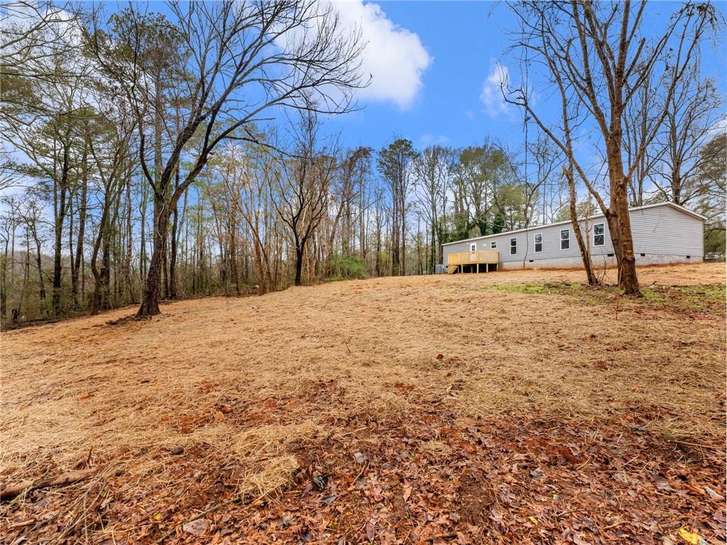 222 Lynn Road Bethlehem, GA 30620 - Photo 42 of 45 a white house that has tree in it