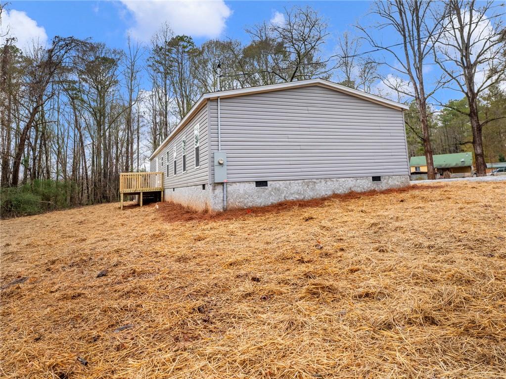 222 Lynn Road Bethlehem, GA 30620 - Photo 43 of 45 a white house that has tree in front of it