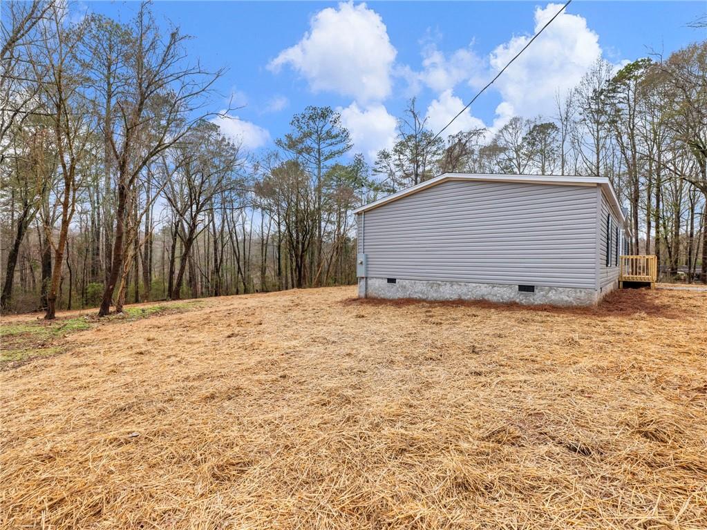 222 Lynn Road Bethlehem, GA 30620 - Photo 44 of 45 a house with trees in the background
