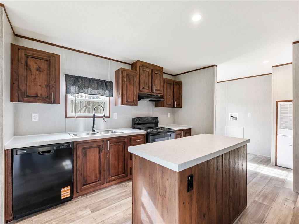 222 Lynn Road Bethlehem, GA 30620 - Photo 7 of 45 a kitchen with a sink a stove a refrigerator and a cabinets