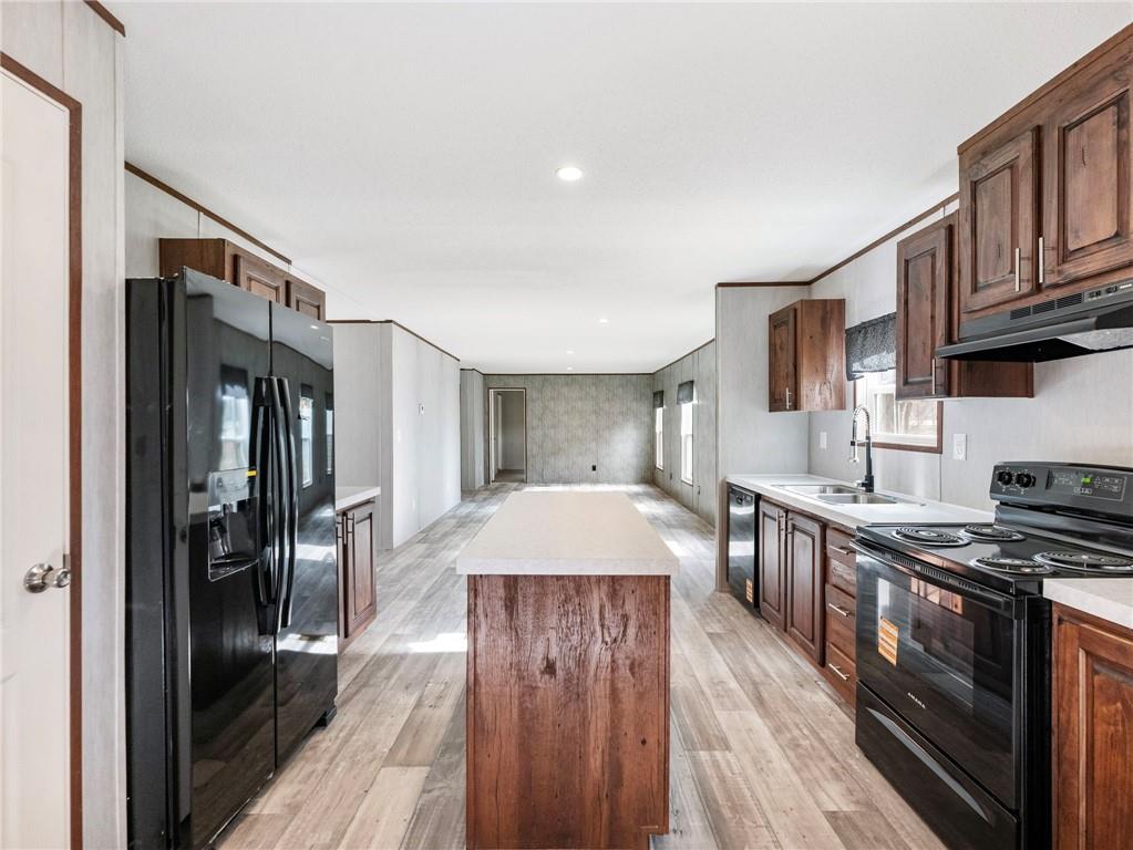 222 Lynn Road Bethlehem, GA 30620 - Photo 8 of 45 a kitchen with stainless steel appliances granite countertop a stove and a refrigerator