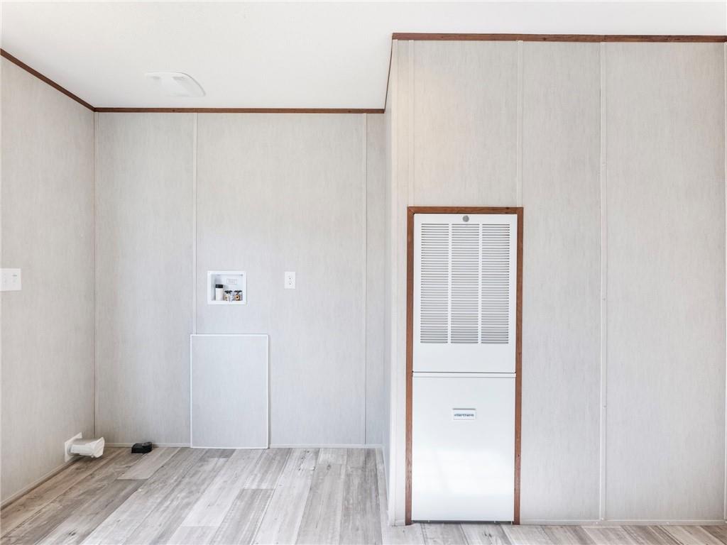 222 Lynn Road Bethlehem, GA 30620 - Photo 9 of 45 a view of walk in closet with wooden floor