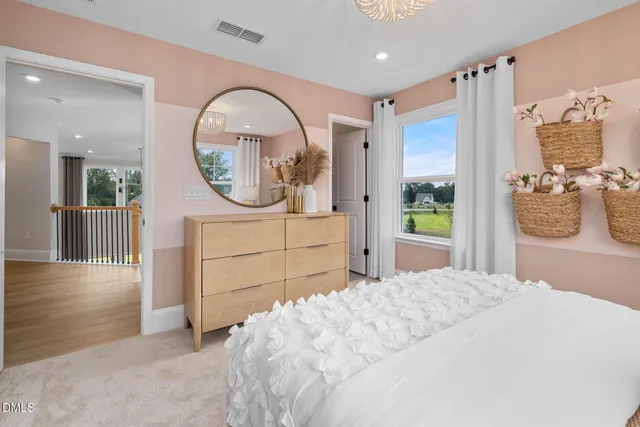 a bedroom with a large bed and a large window