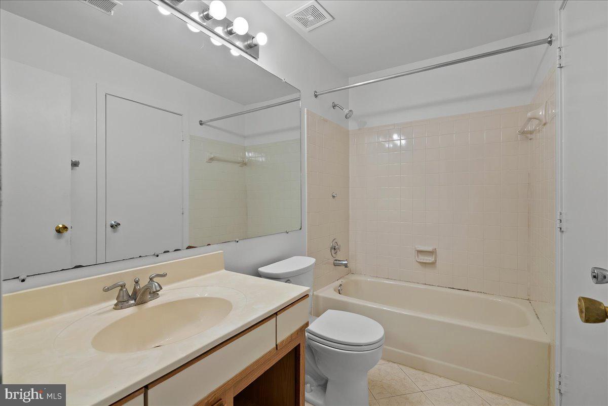 11719 Summerchase Circle Reston, VA 20194 - Photo 15 of 25 a bathroom with a sink a toilet and shower