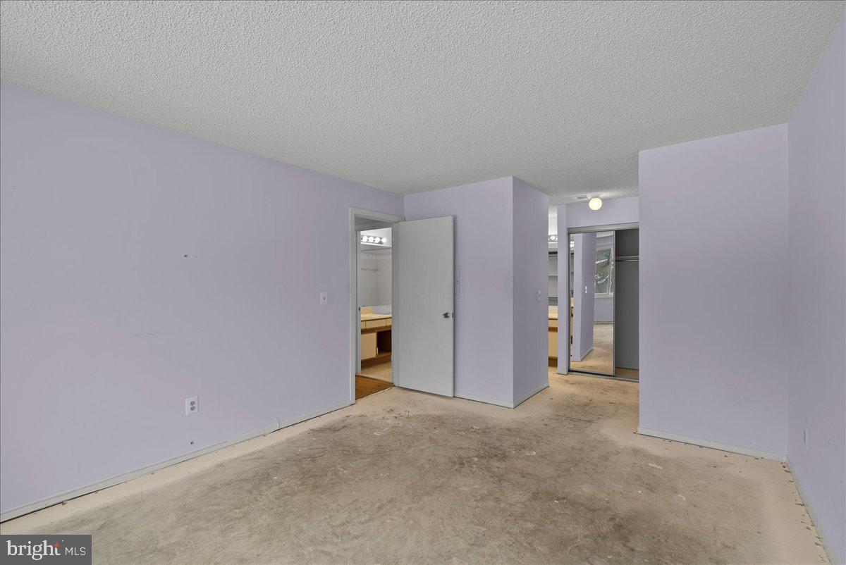 11719 Summerchase Circle Reston, VA 20194 - Photo 18 of 25 a view of a big room with windows and refrigerator