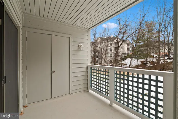 a view of a balcony with wooden fence