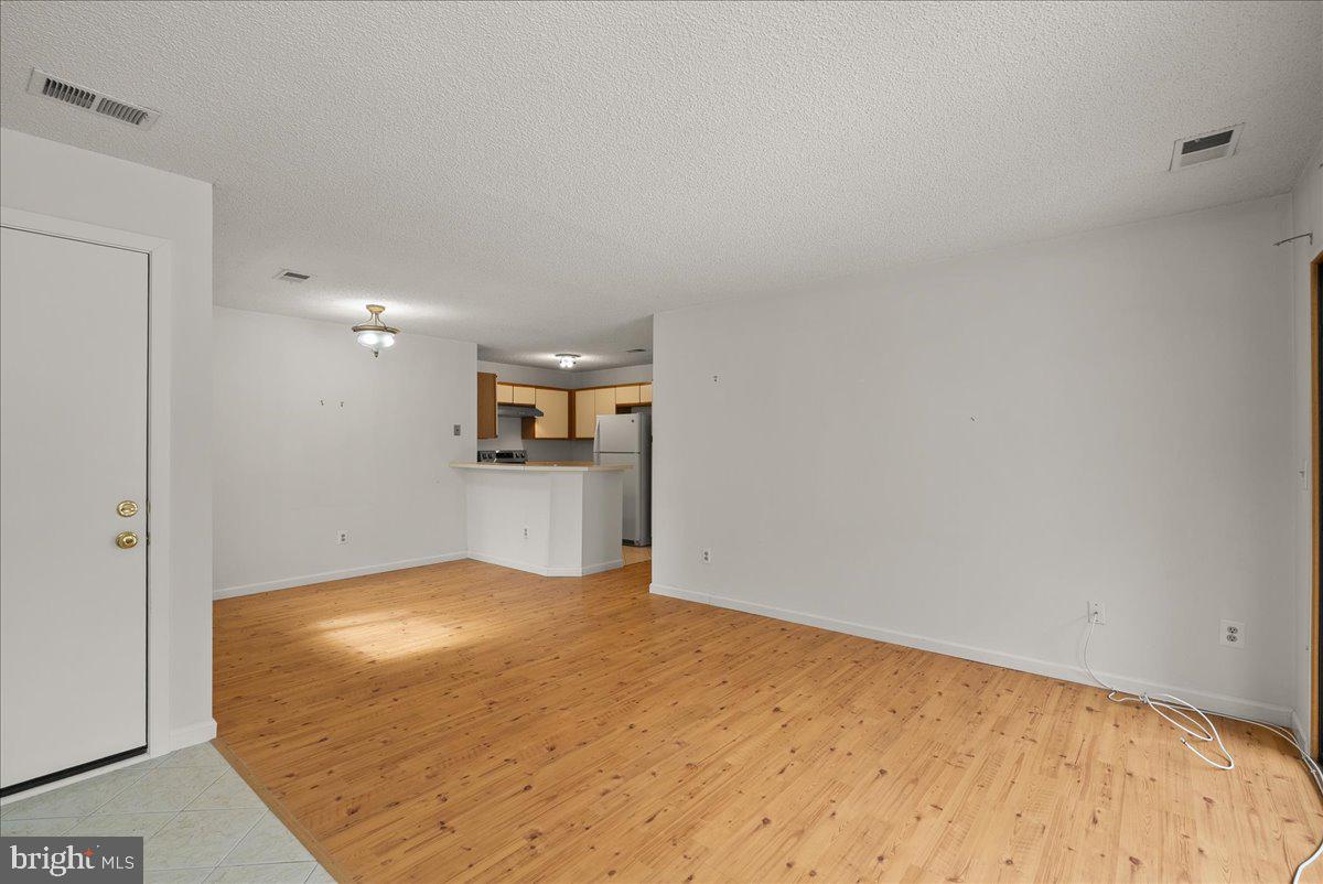11719 Summerchase Circle Reston, VA 20194 - Photo 4 of 25 a view of a kitchen with a sink and a refrigerator