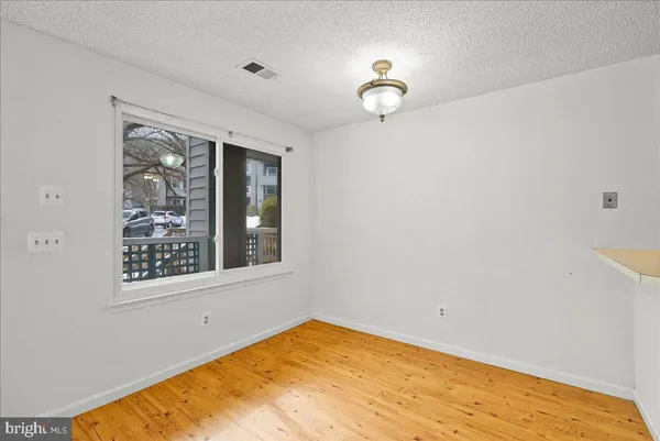 a view of an empty room with glass door
