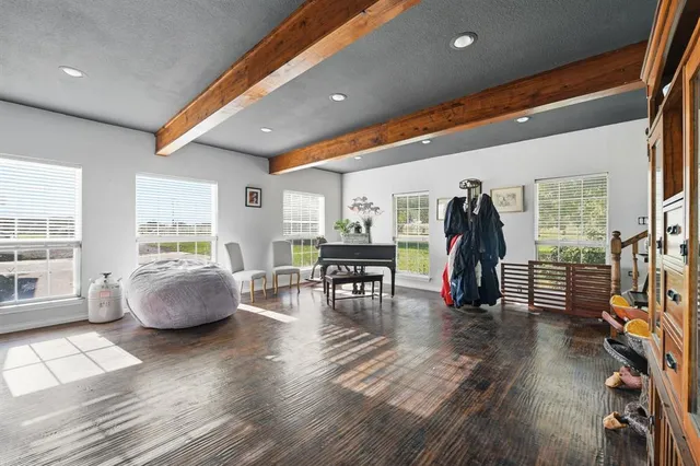a livingroom with furniture and wooden floor