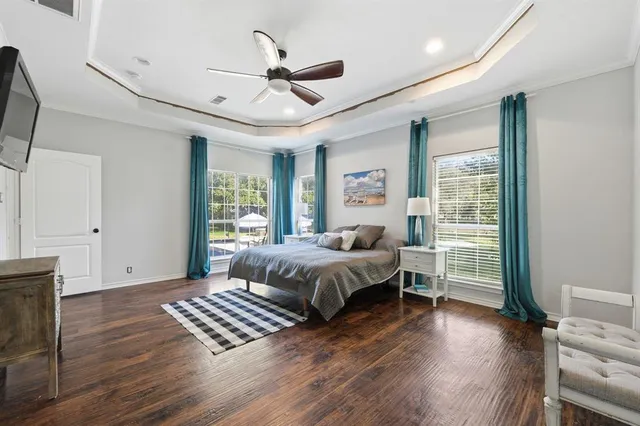 a bed room with a bed and a chandelier