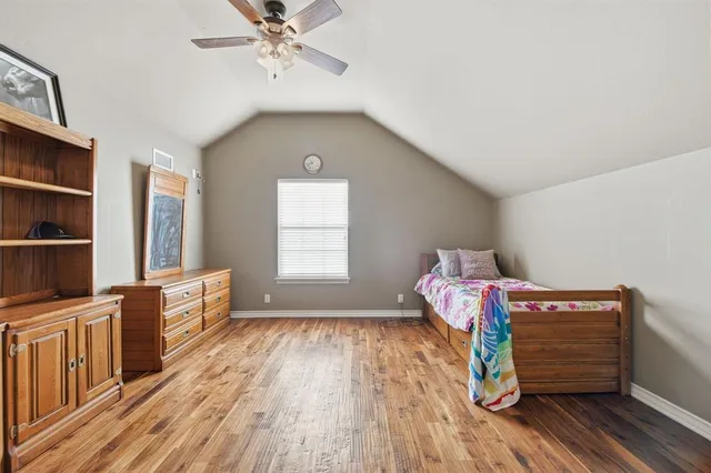 a view of a livingroom with lounge chair and a barbeque