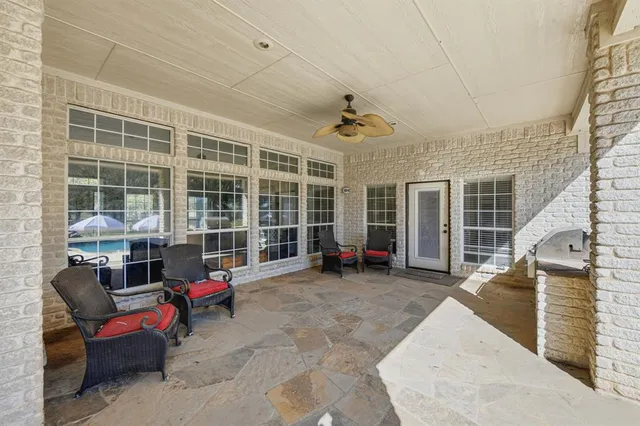 an aerial view of multiple houses with yard