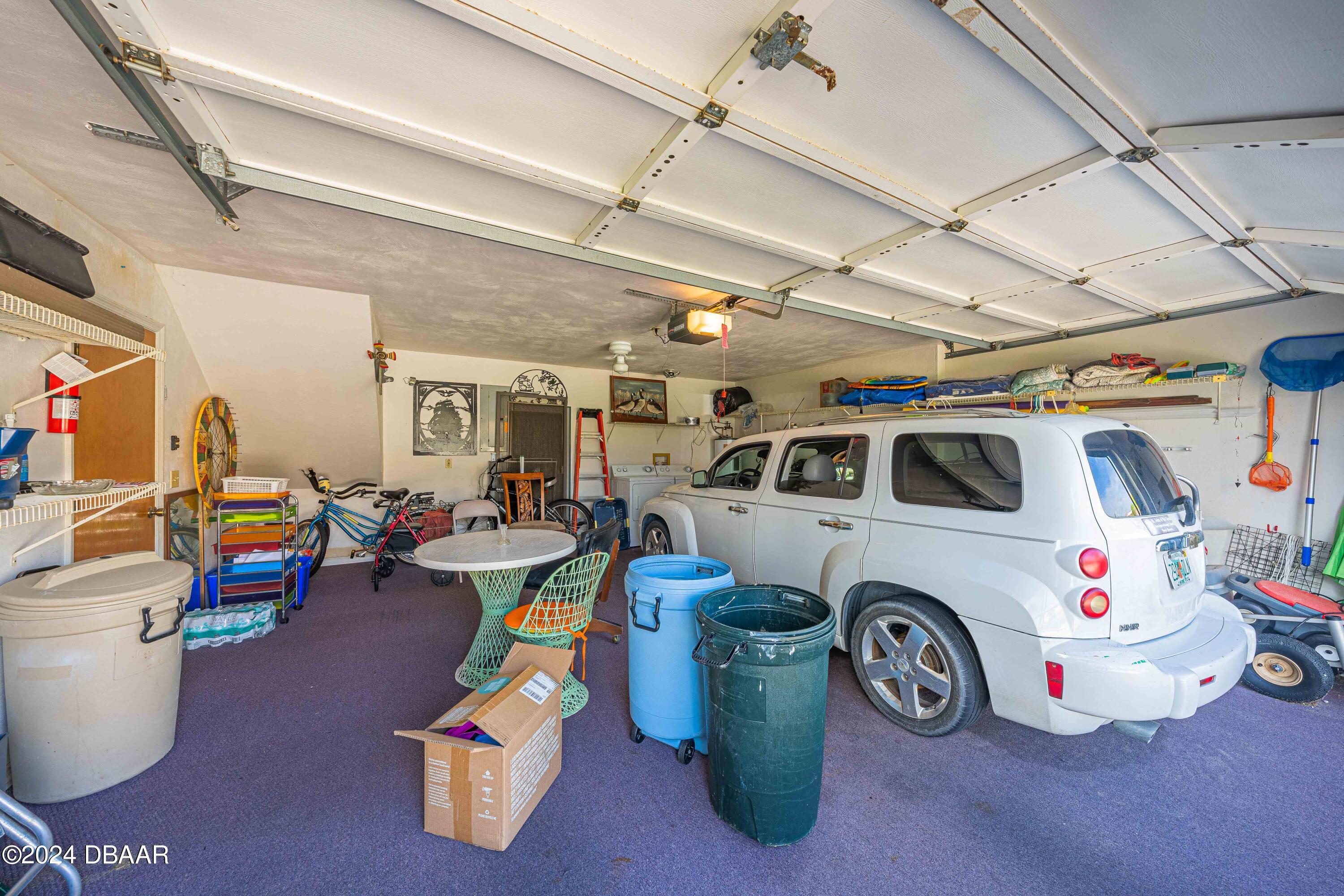 42 Jana Drive Ponce Inlet, FL 32127 - Photo 28 of 34 a view of a garage with a car parked